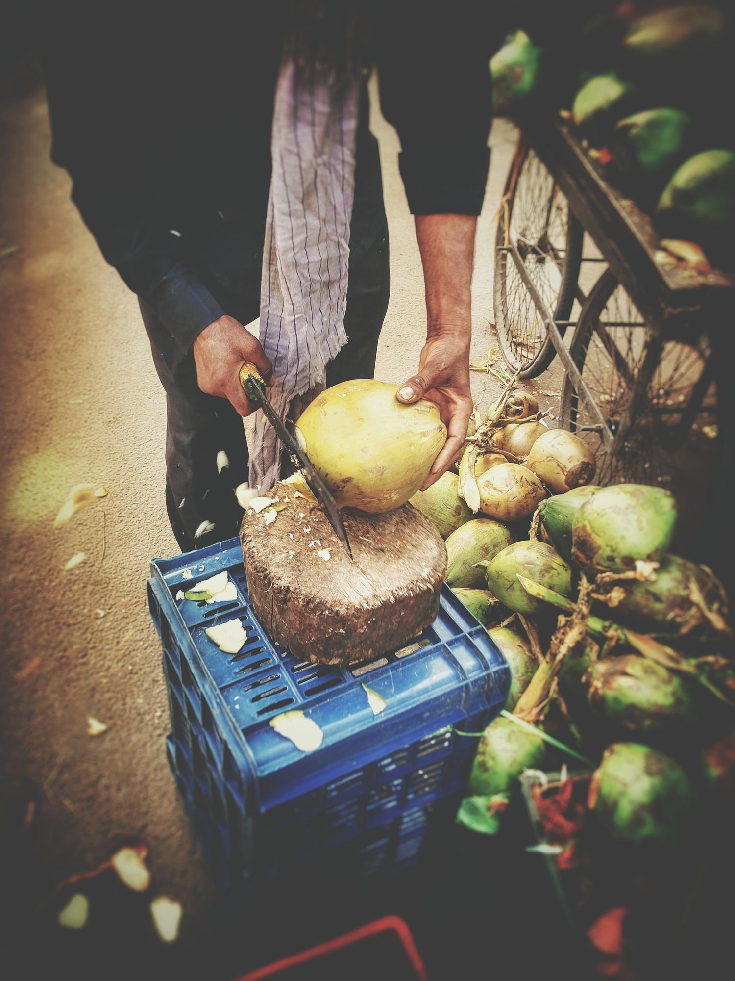 Farmer with crates of root vegetables