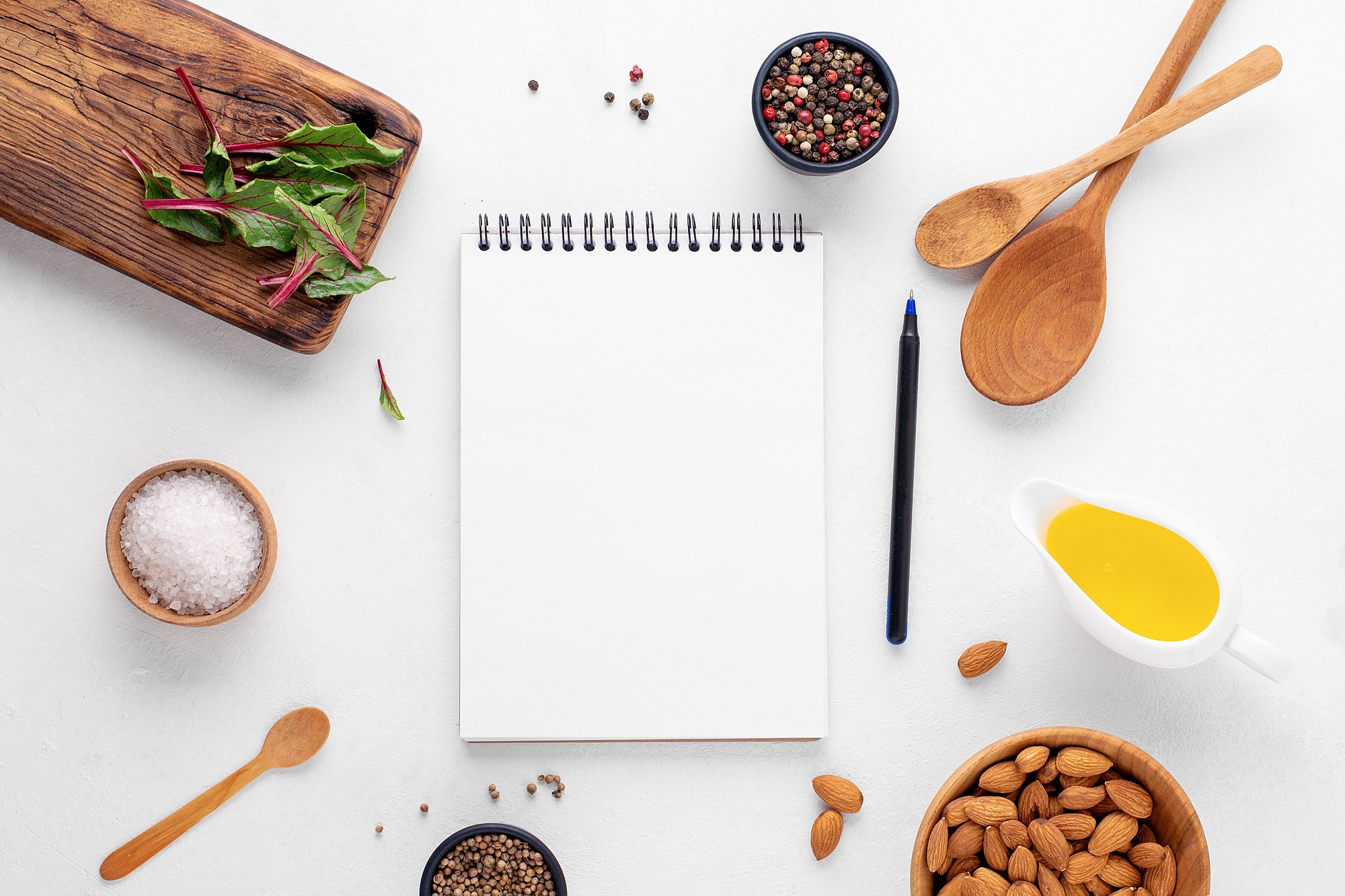 Flat lay of seasonal ingredients and notebooks